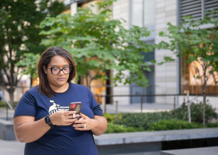 LSLD Volunteer looking down at phone