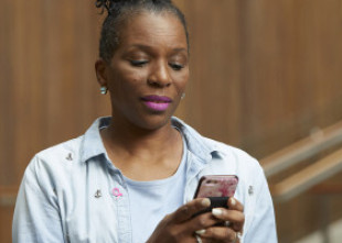 Woman typing on her phone