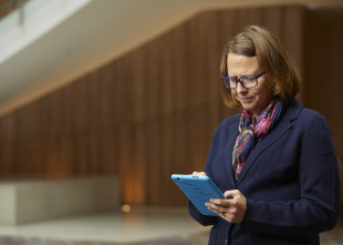 Volunteer working on their tablet