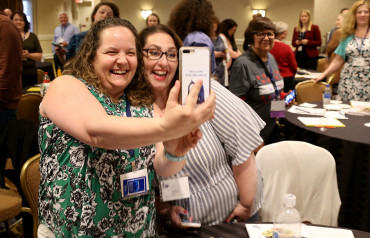 Volunteers taking a selfie photo at an event