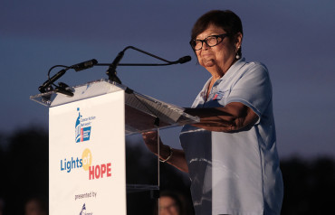 Volunteer speaking at Lights of Hope