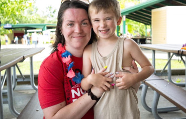 Leah McCleary smiling with young son