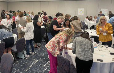 Young Leaders Summit participants working at breakout tables