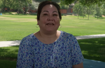 Video still of woman in park being interviewed
